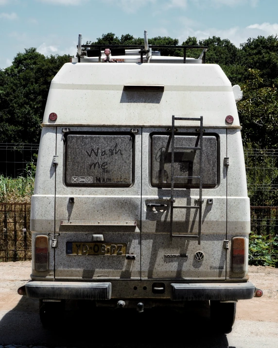 a van with a ladder down to the side of it