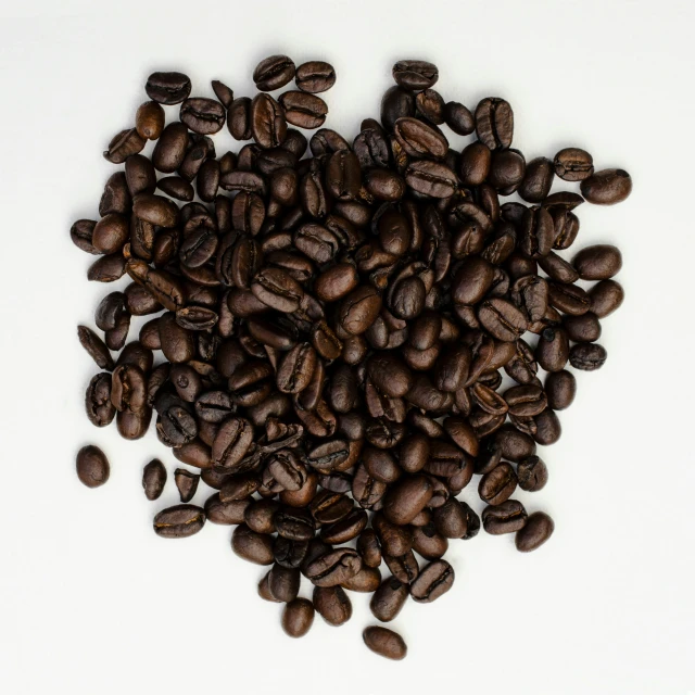 a pile of coffee beans lying on top of each other