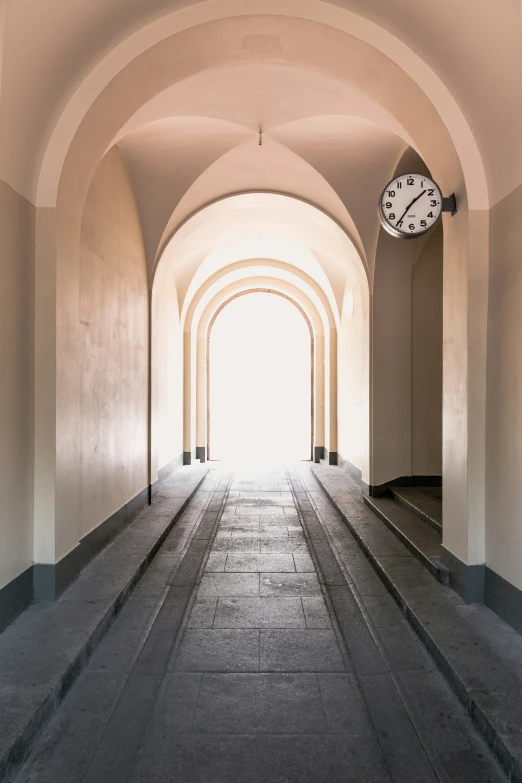 an image of a long corridor with a clock