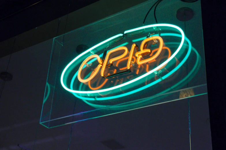 a neon sign for a restaurant called opps