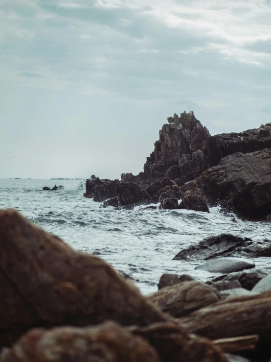 the rocks are rocky and clear as water comes up from them