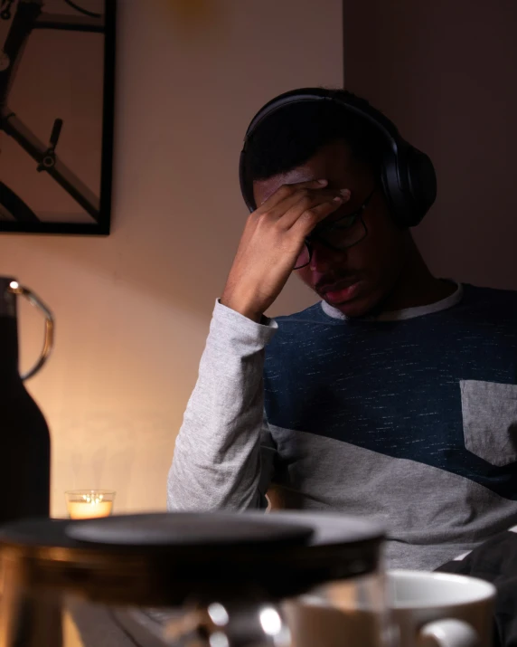 a person with headphones sitting down