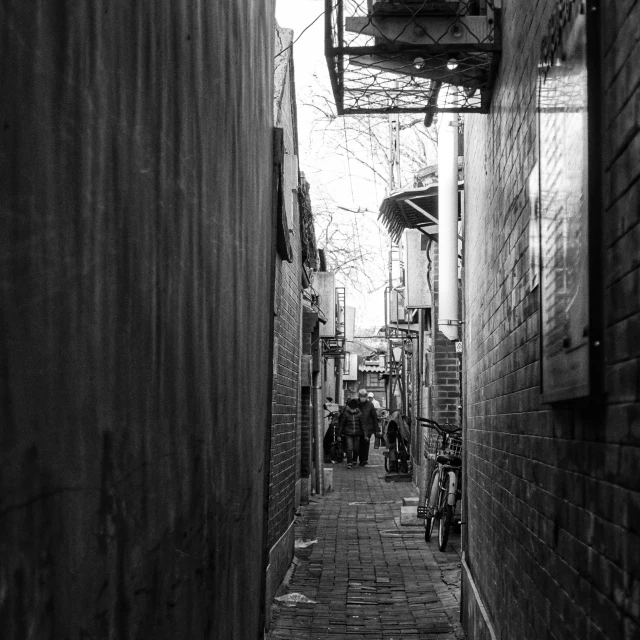 an empty alleyway on a brick street