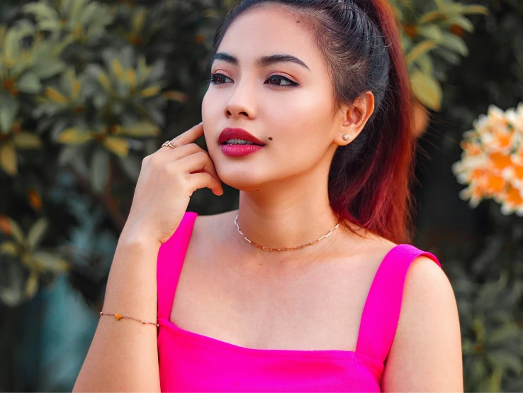 an image of a woman wearing a pink top