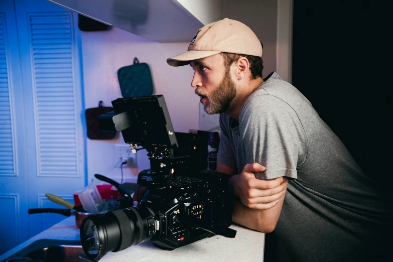 a man that is sitting in front of a camera