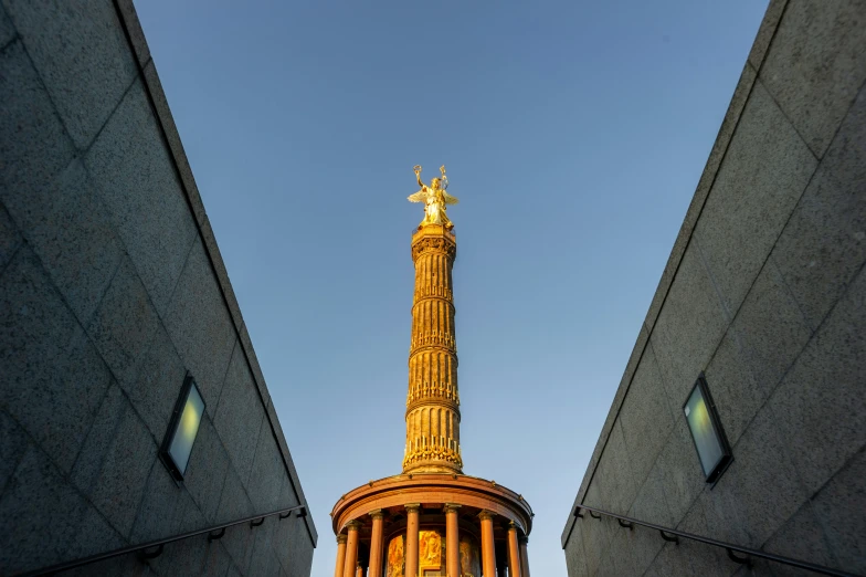 a big building with a large tower and a gold clock