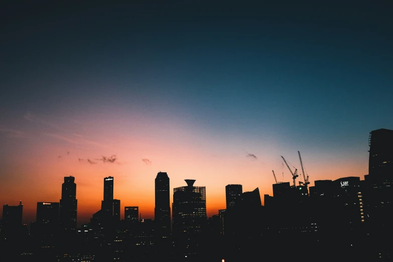 a view of city at twilight from the shore