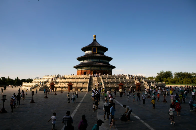 a number of people walking near a building