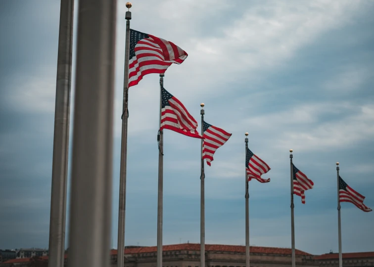 several american flags are placed next to each other