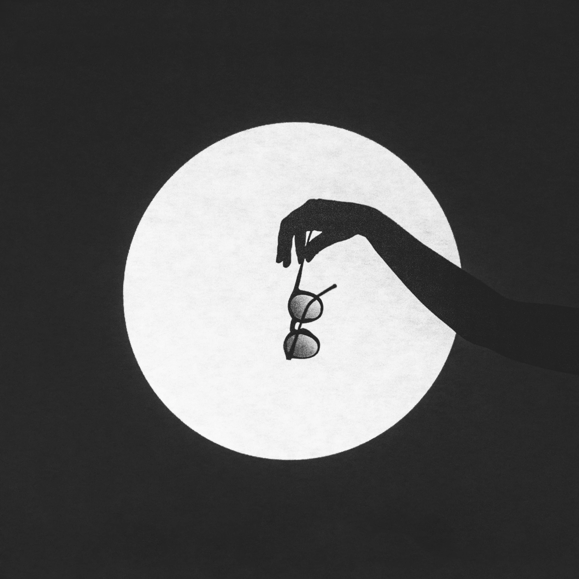 a person with their hands and eye glasses in front of a full moon