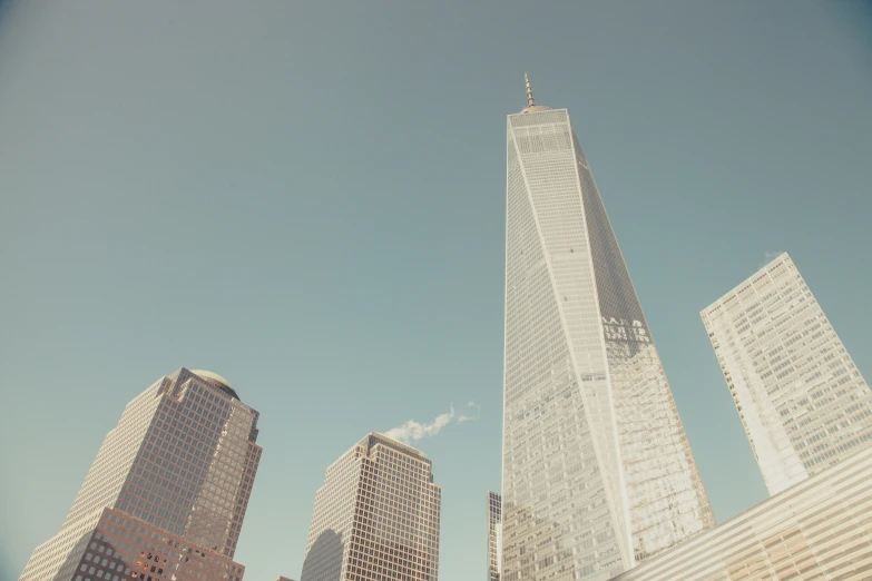 the skyscrs in the city have clear blue skies