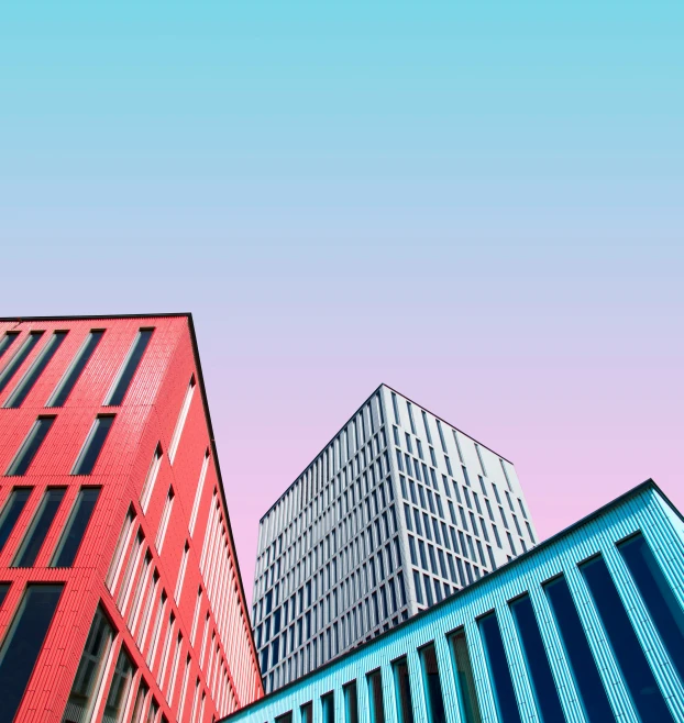 four different colored buildings side by side