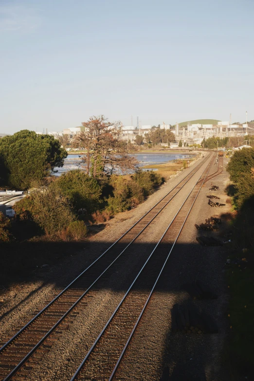 two set of tracks crossing a waterway in a town