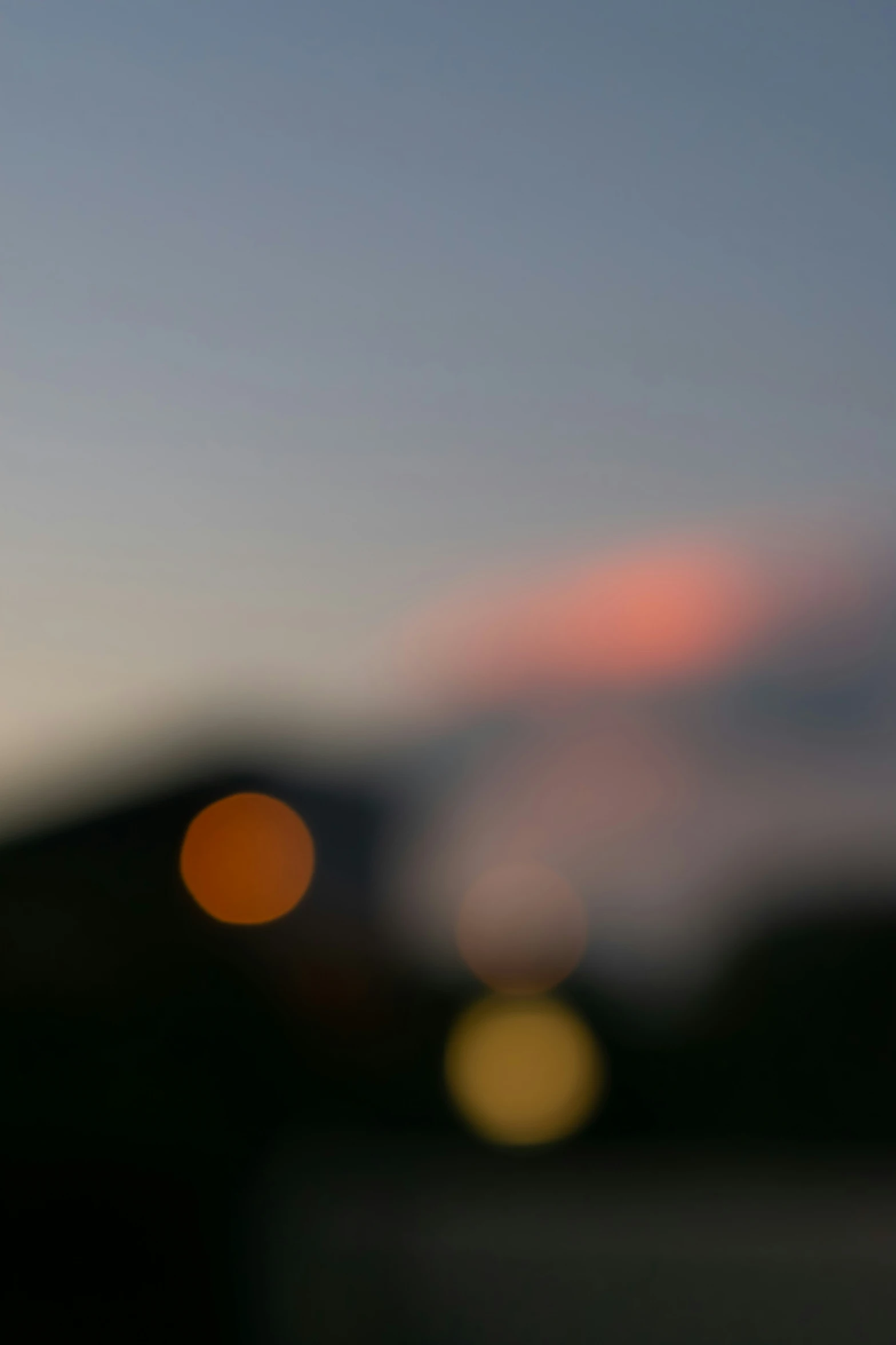 blurred picture of sunset in background with the sun setting