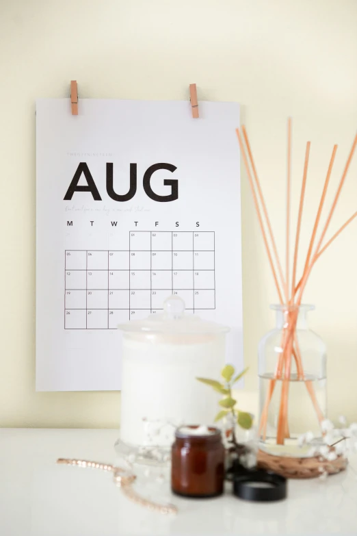 an a calendar and some candles next to each other