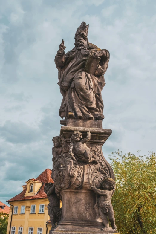 this sculpture is depicting the person standing in a robe