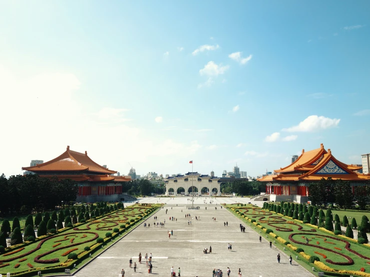 an overview of a building with a lot of greenery in front