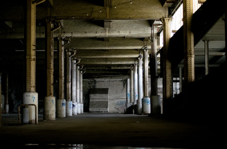 there is a very long corridor between two rows of concrete pillars