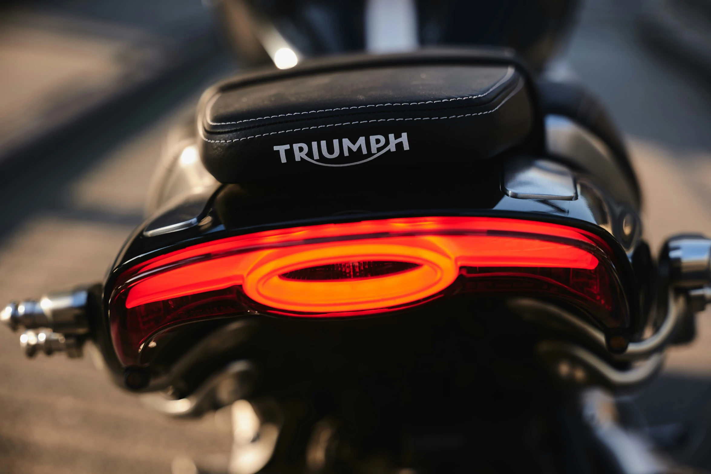 the tail light of a motorcycle, and some signs on it