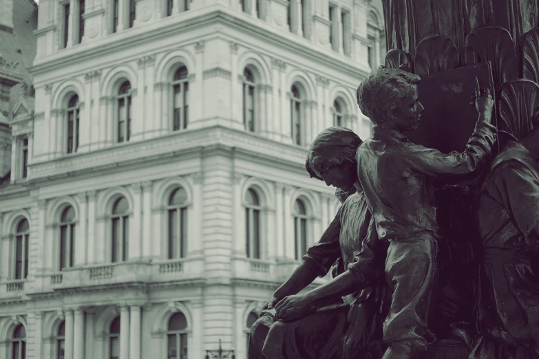 the monument of two children has been erected near a tall building