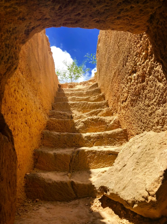 a very narrow tunnel with many steps inside