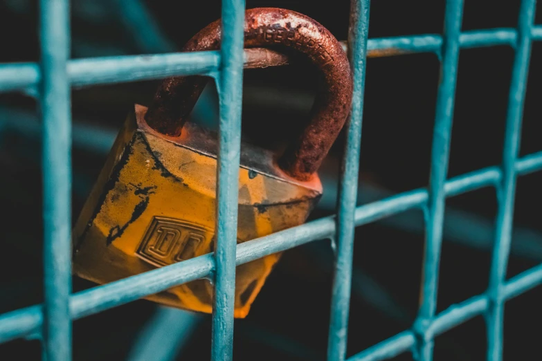 a padlock that is attached to a gate