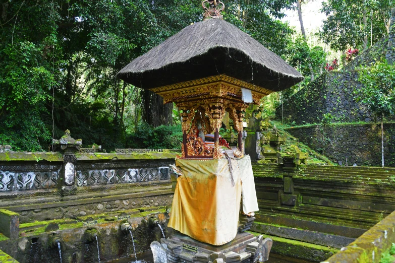 the stone water features in the garden of a temple
