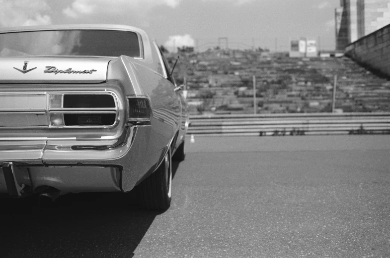 a old car that is sitting on the side of a road