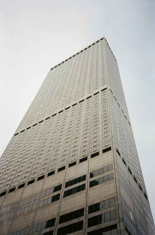 a tall building is towering into the sky