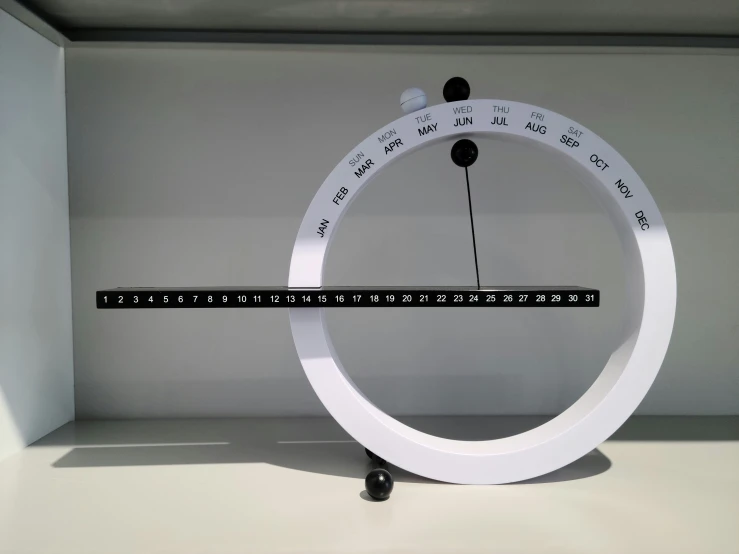 the electronic clock is sitting in a display case