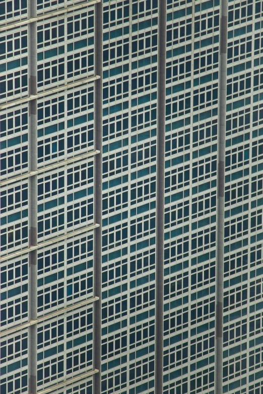 the top of an airplane flying by the building