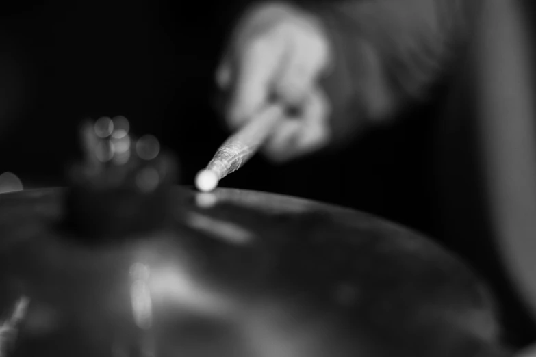 a close up s of a person using a stirrer