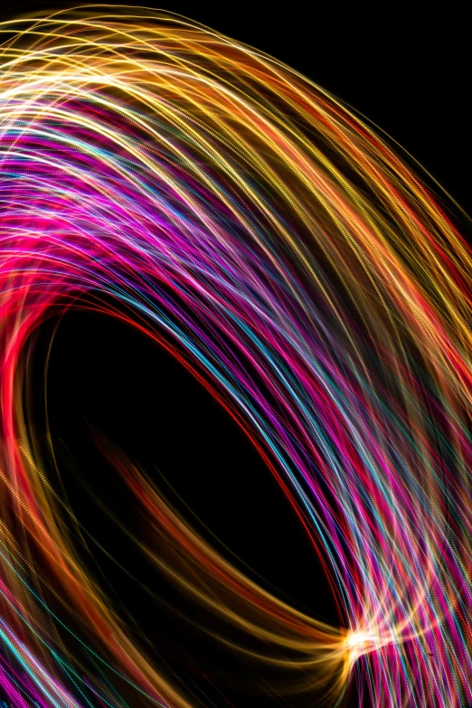 an abstract swirl of colors with black background