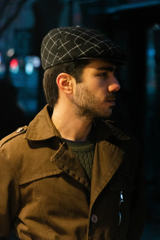 man in hat wearing brown jacket and jacket outside