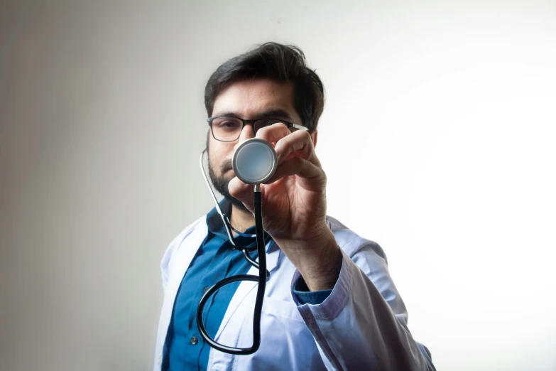 the young man is listening to his medical record