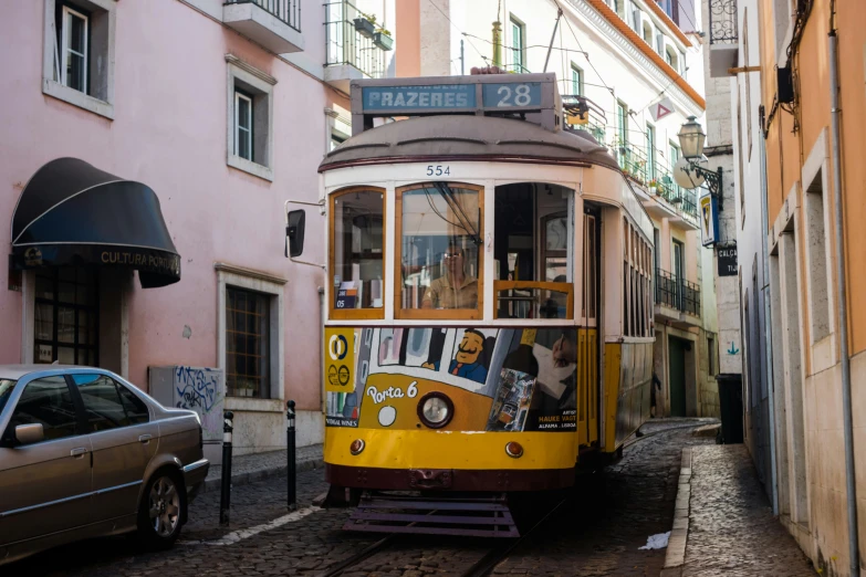 trolley on tracks moving past in an alleyway