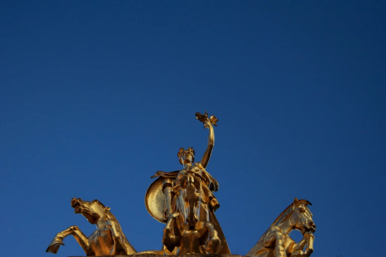 a statue of a woman holding a bird is in the foreground