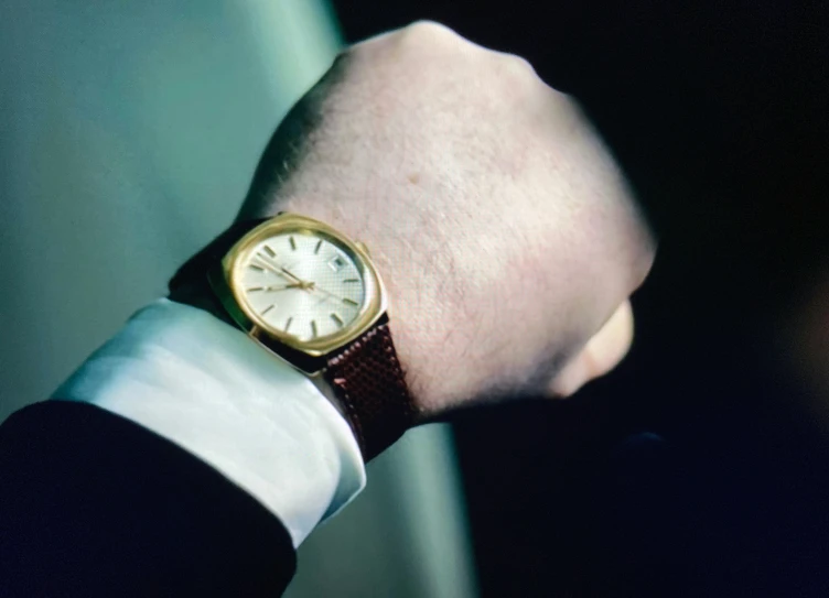 a person's wrist with a watch on it