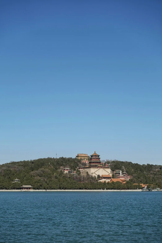 the large tower is on top of a small island