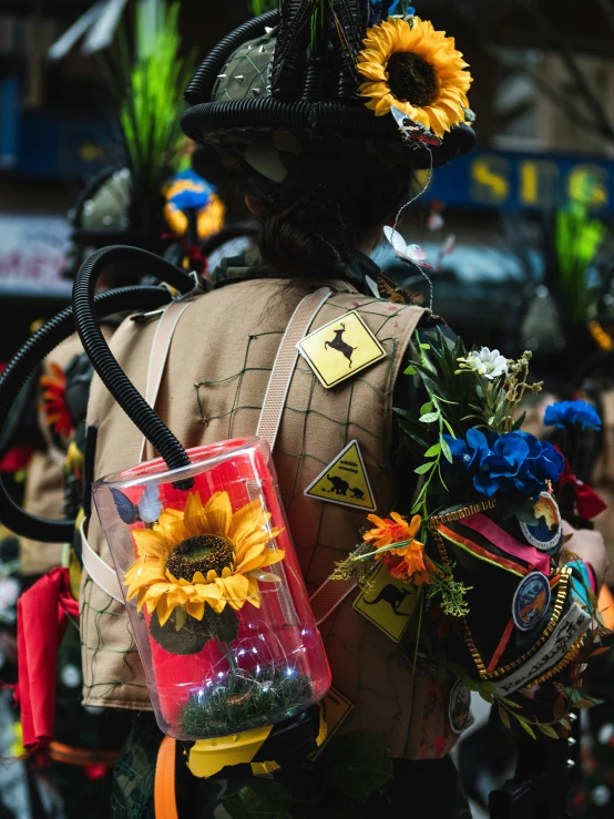 a person with flowers and a hat wearing a bag