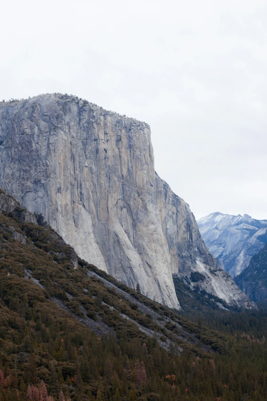 a big tall mountain sitting in the middle of a field