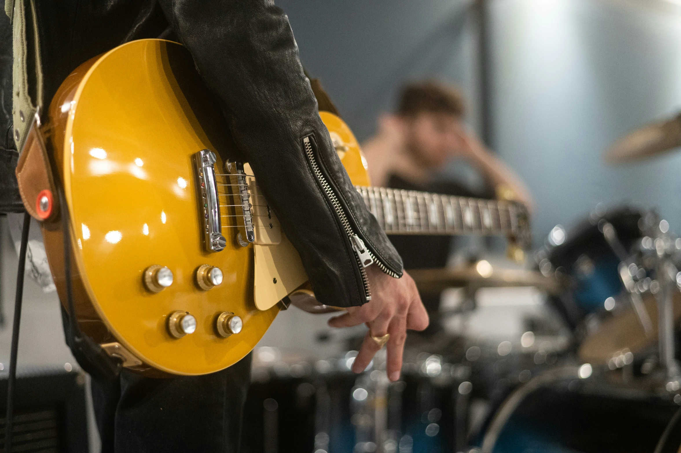 some guys are playing their instruments together in the music studio