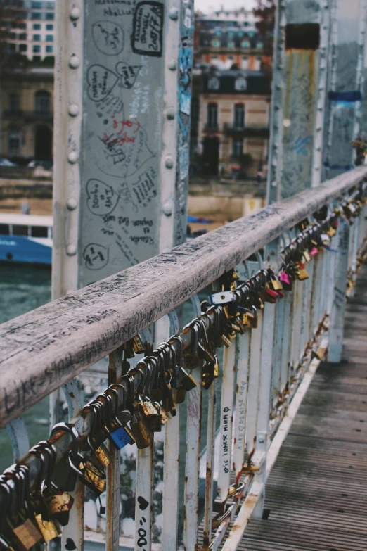 the bridge has many padlocks for each door