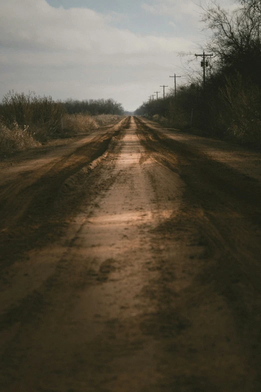 this image shows a road with dirt on the side