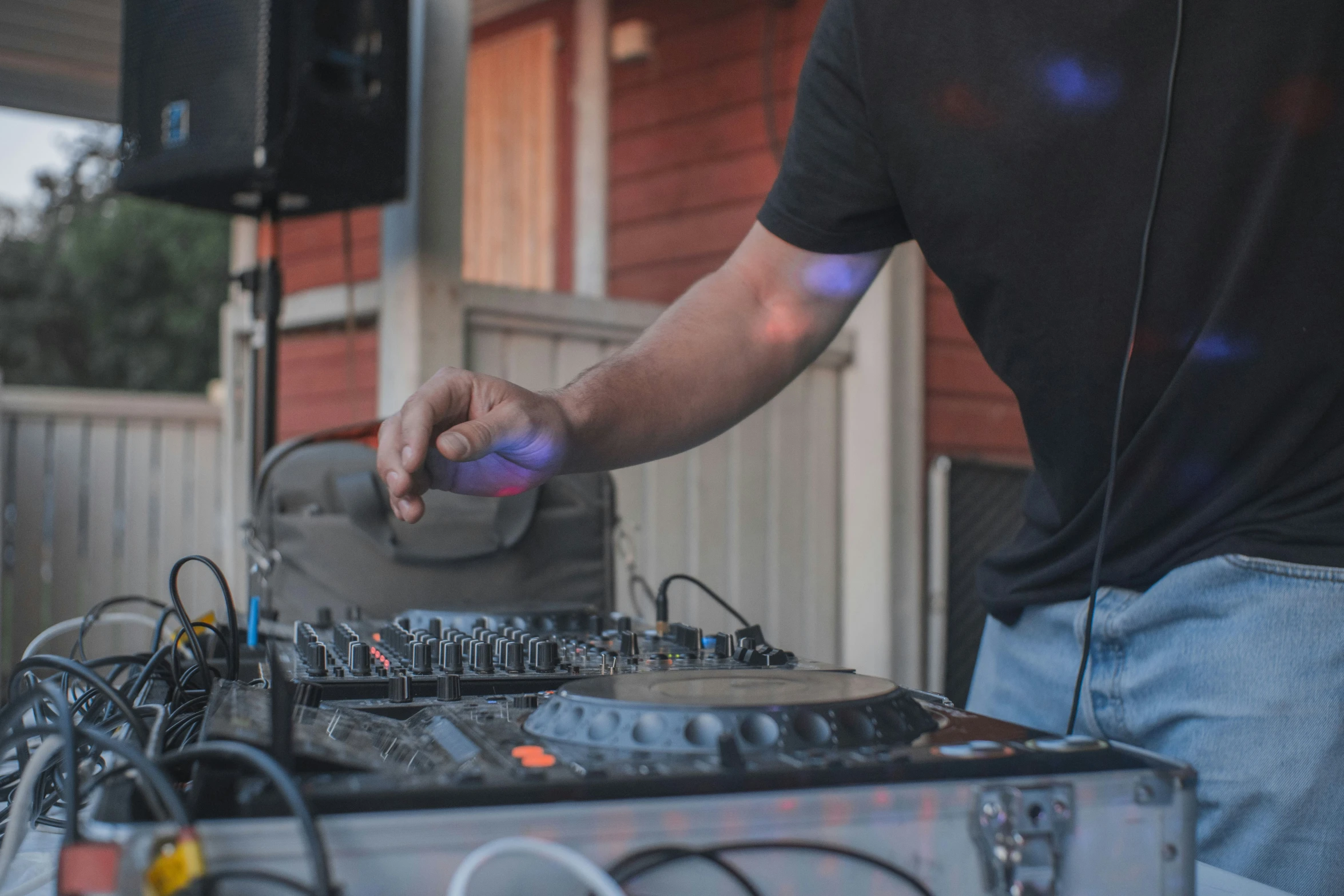 a dj spins out his equipment during the day