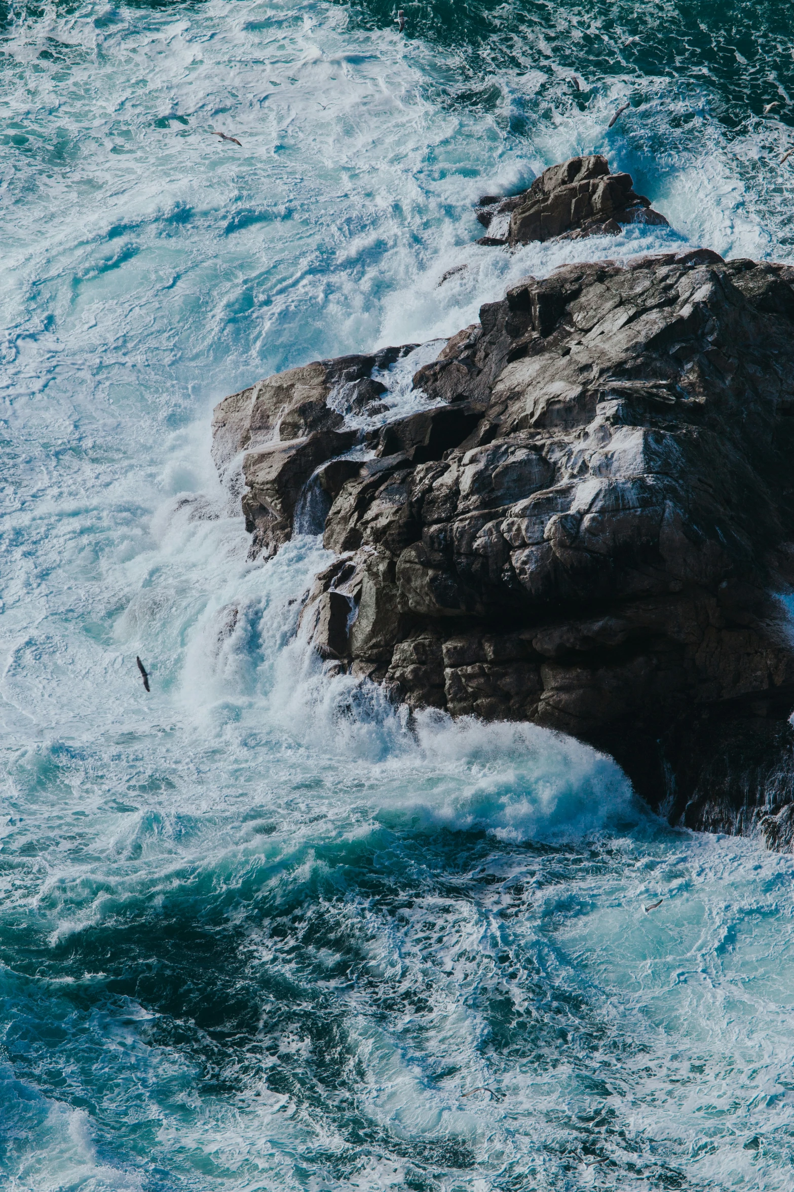 some rocks and water in the ocean