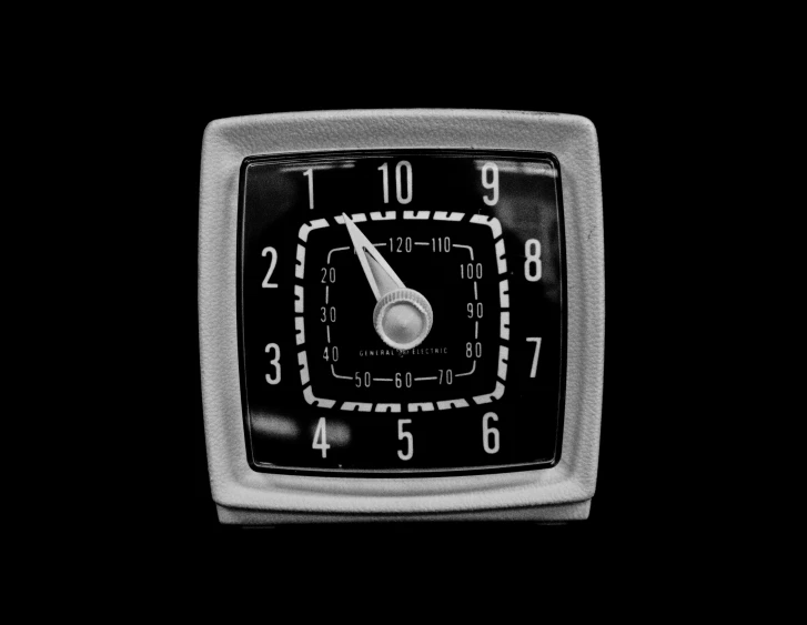 a black and white image of an alarm clock