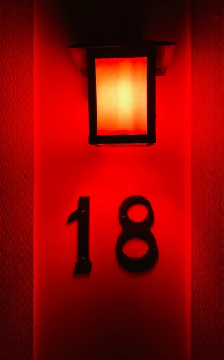 a lit up sign that has numbers underneath it