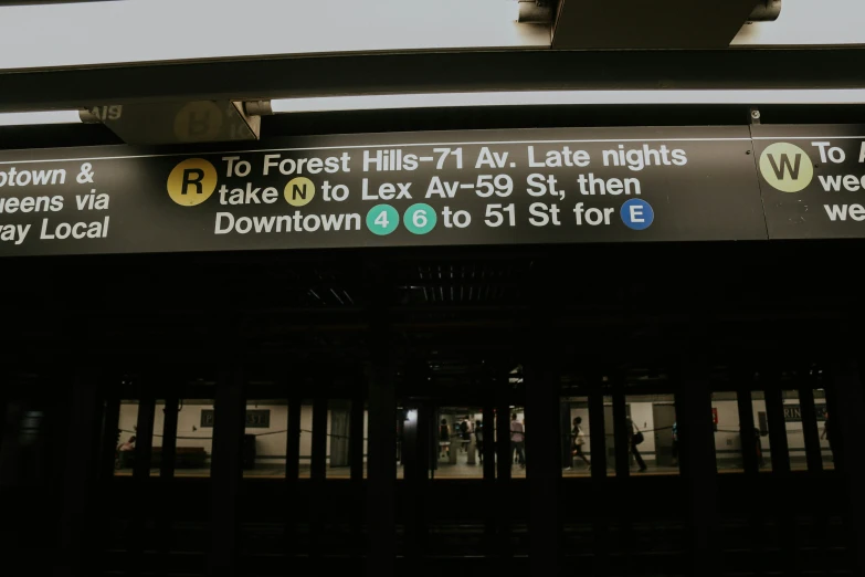 an electronic sign at the entrance to a subway stop