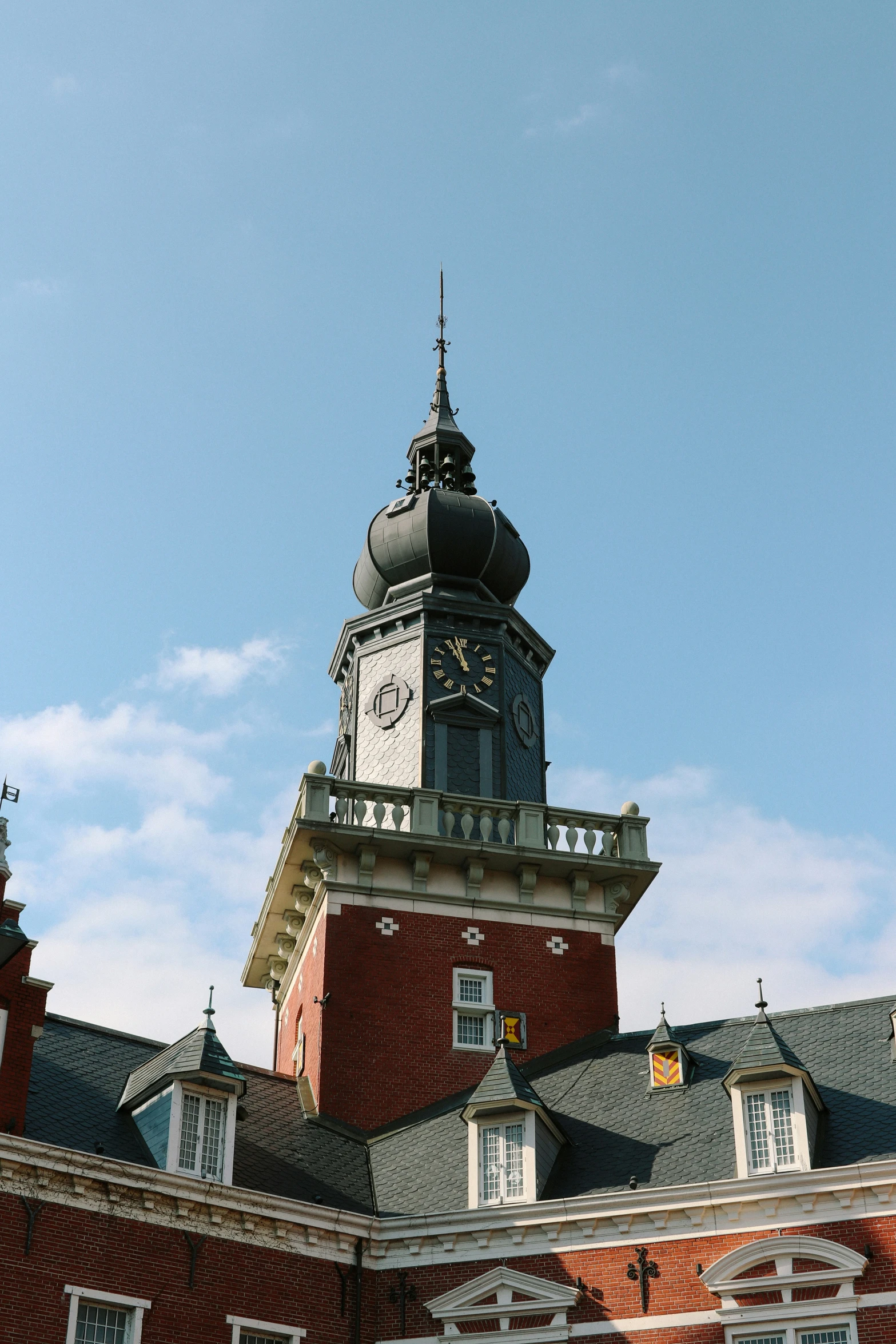 a clock tower sits high on top of a building